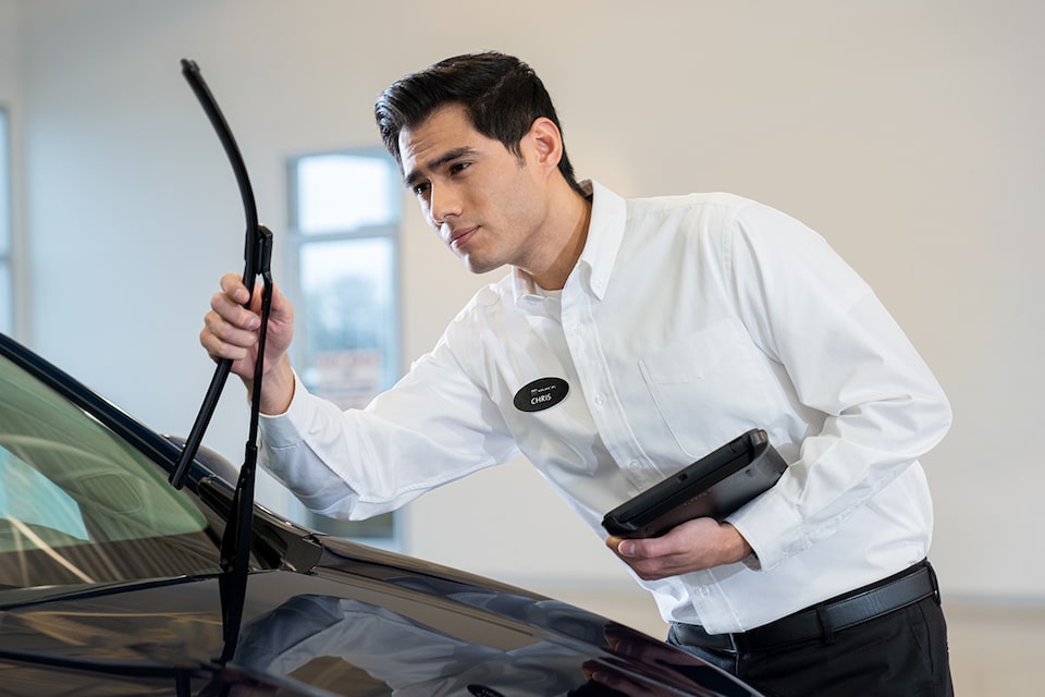Certified Service technician installing new ACDelco Silver beam wiper blades