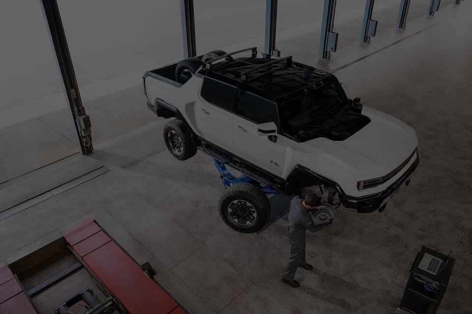 Certified Service technician changing the wheels of an EV