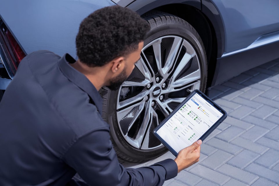 Certified Service advisor performing a Vehicle Health Check.