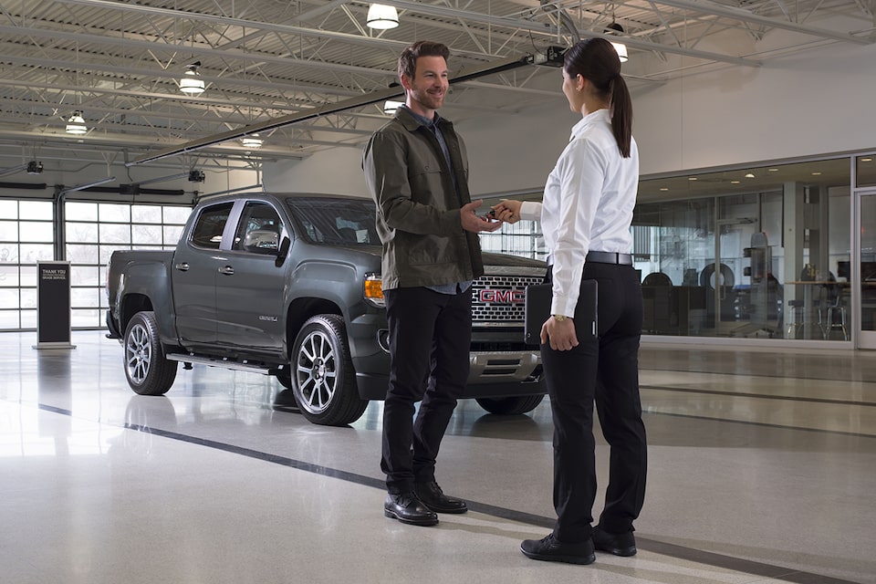 Certified Service representative discussing with an owner a comprehensive assessment of their vehicle